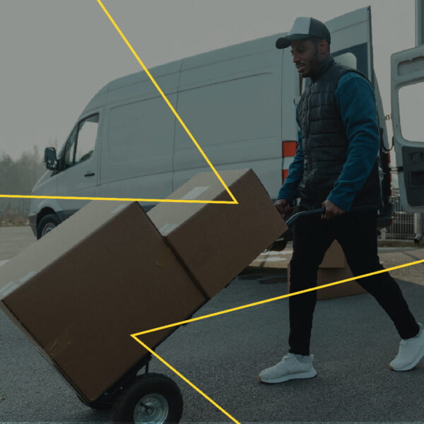 Man lifting boxes with stack truck